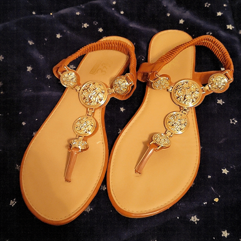 Sandals with gold coin medallion accents. Size 7. M & E Collection